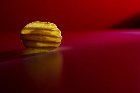 Corrugated chips in red light on a background Stock Photos