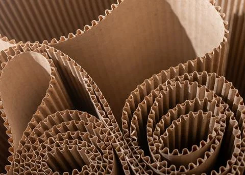 Corrugated paper packaging inserts in close up. Brown protective material wit Stock Photos