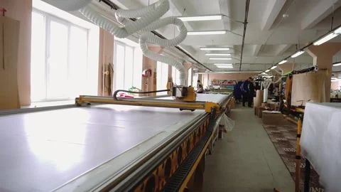 Corrugated plastic pipe connected to cutter on conveyor Stock Footage 236908541