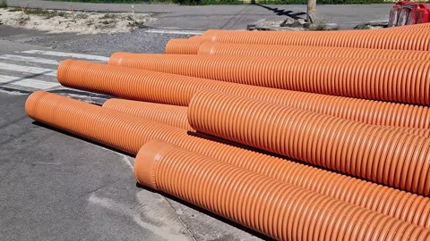 Corrugated sewer pipe, double-layer. Pipes stacked together, repair work Stock Footage 316260968