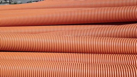 Corrugated sewer pipe, double-layer. Pipes stacked together, repair work Stock Footage 316261007