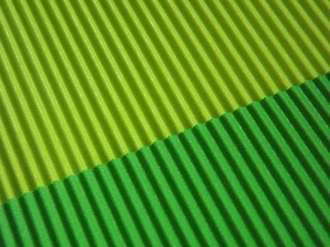 The corrugated surface is multicolored with parallel lines as a background bl Stockfoto's