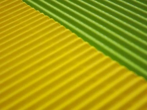 The corrugated surface is multicolored with parallel lines as a background .. Foto stock