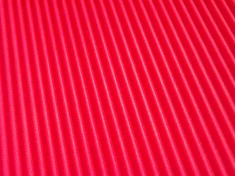 The corrugated surface is multicolored with parallel lines as a background .. Stockfoto's