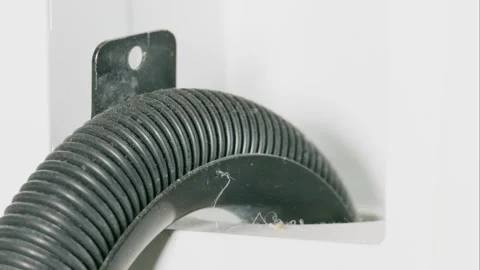 Corrugated Washing Machine Drain Hose in Plastic U-Bend Guide Stock-Footage 331403746