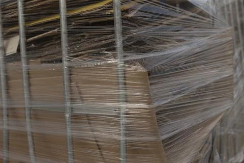 Corrugated waste bag placed on trolley during cleanup process Stock Photos