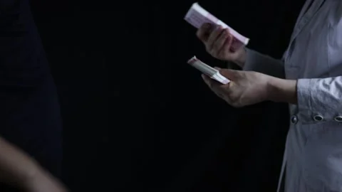 Corrupt businessman receiving bribes for doing business Stock Footage 228707832