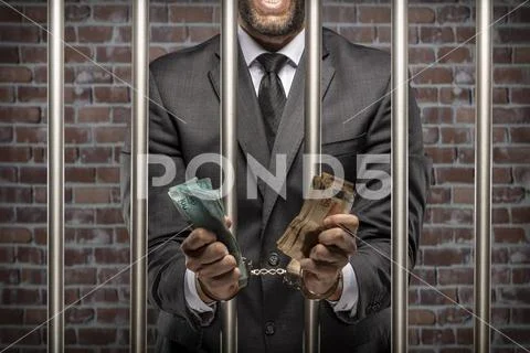 Corrupt man holding bills of money Stock Photos
