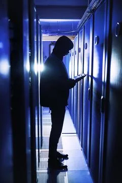 Corrupting even the smallest of weakness in the system. a hacker using a digital Foto stock