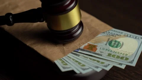 Corruption and bribery concept. Close-up Judge gavel and dollar money on a .. Video stock 292973856