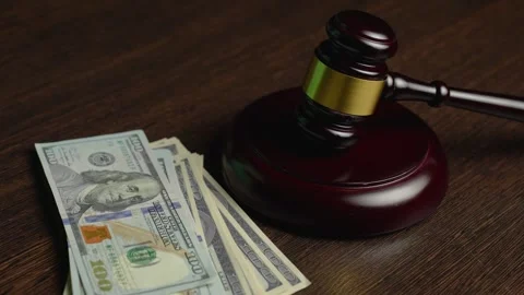 Corruption and bribery concept. Close-up Judge gavel and dollar money on a .. Stock Footage 292973975
