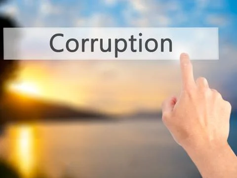 Corruption - Hand pressing a button on blurred background concept on visual s 스톡 사진