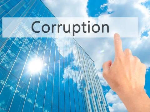 Corruption - Hand pressing a button on blurred background concept on visual s Stock Photos