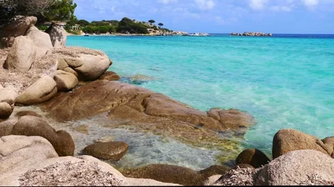 Corsica, path on the beach of Santa Giulia. Video stock 309769499