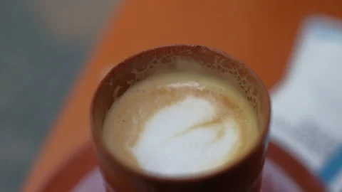 Cortado in a brown clay cup Stock Footage 239237152