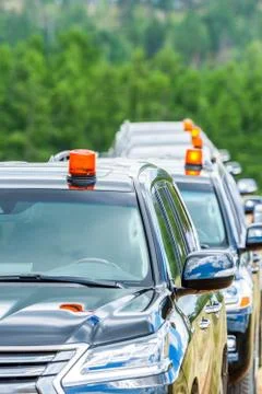 Cortege of black suvs Stock Photos