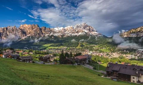 Cortina d'Ampezzo town panoramic view with alpine green landscape and massive Stock Photos