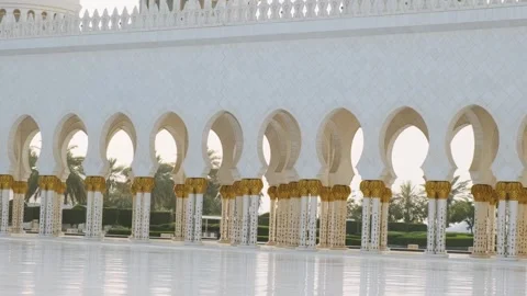 Cortyard view of Sheikh Zayed Grand Mosque with ornate columns with golden paln Stock Footage 284347725