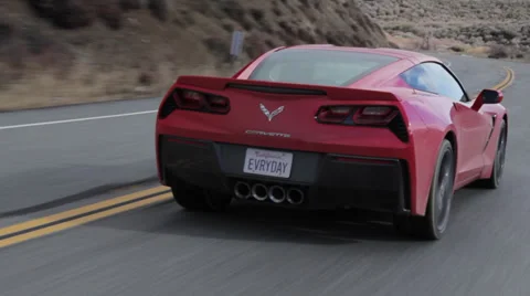 Corvette C7 Stingray Rear three-quarter camera follow Stock Footage 34756949