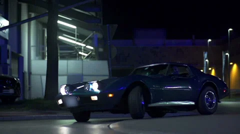 Corvette's drive by in slow motion at the night-time Stock Footage 33002170