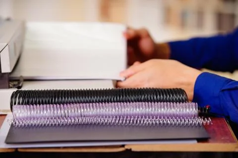 Cose up of plastic ring of different sizes and colors used for binding documents Stock Photos