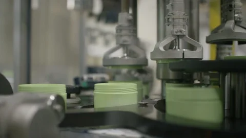 Cosmetic boxes being packed by machine on production line Stock Footage 107962336