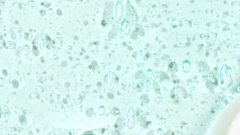 Cosmetic Gel Fluid With Molecule Bubbles Flowing On The Plain White Background Stock Footage 272591459