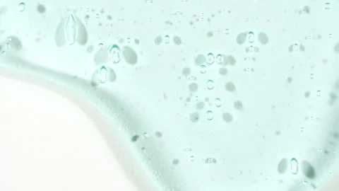Cosmetic Gel Fluid With Molecule Bubbles Flowing On The Plain White Background Stock Footage 276992443