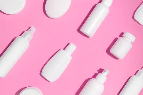 Cosmetic mock up pattern on pink background Stock Photos