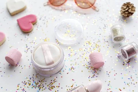 Cosmetic objects and confetti isolated on background Stock Photos