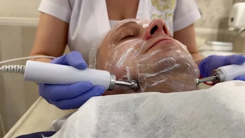 Cosmetic procedures of microcurrents on the face Stock Footage 244814289