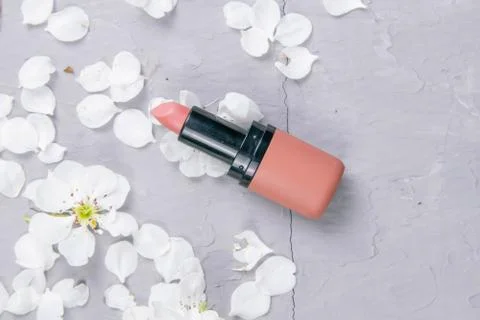 Cosmetic set on grey dressing table. Top views, close-up. Lipstick stands on  Stock Photos