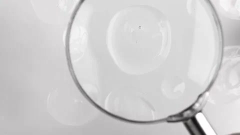 Cosmetic texture closeup top view. Drops of transparent liquid hyaluronic acid Stock Footage 222752262