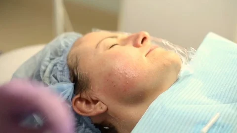 Cosmetician doing shots of botox to her client's face Stock Footage 76187807