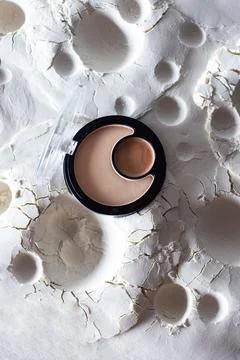 Cosmetics on abstract lunar surface Stock Photos