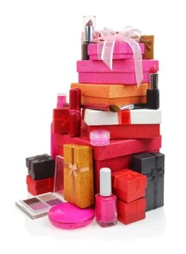 Cosmetics and stack of gift boxes on white background Stock Photos