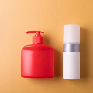 Cosmetics containers on yellow Stock Photos