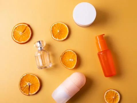 Cosmetics containers on yellow Stock Photos