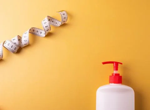 Cosmetics containers on yellow Stock Photos