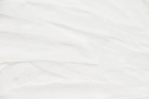 Cosmetics. Cream white background texture. Stock Photos