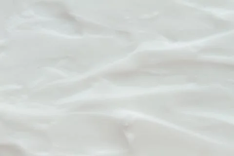 Cosmetics. Cream white background texture. Stock Photos