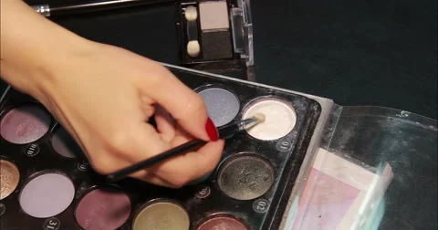 Cosmetics. Eyeshadows. Arm with brush. Close-up. Stock Footage 53082445
