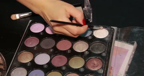 Cosmetics. Eyeshadows. Arm with brush. Stock Footage 53082355