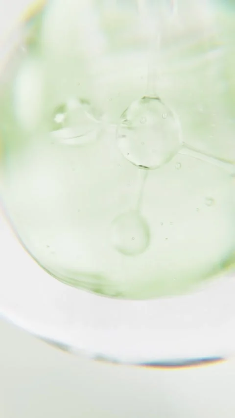 Cosmetics green serum liquid bubble 3d abstract background. Cosmetic moisturizer Stock Footage 344647604