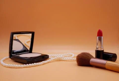 Cosmetics on orange background Stock Photos