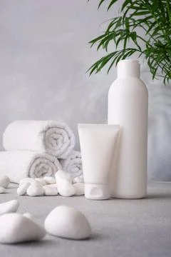 Cosmetics packaging . Plastic cosmetic’s bottle and tube of cream and shamp Stock Photos