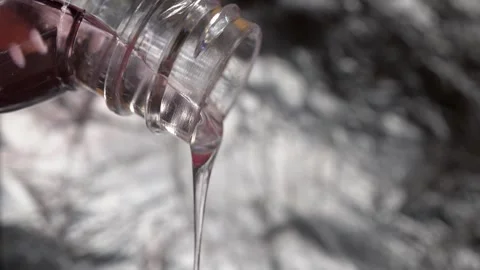 Cosmetics pouring out of a bottle Stock Footage 297395065