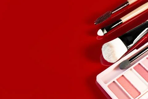 The cosmetics on red glossy plate top view image...The cosmetics on red glo.. Stock Photos