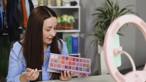 Cosmetics shopping haul or makeup unpacking on cell. Female beauty blogger Stock Footage 242570619