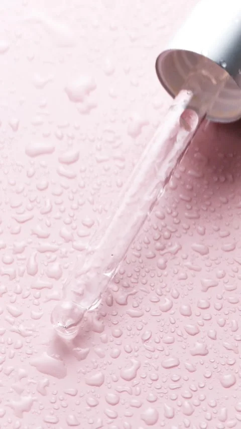 Cosmetics texture. close-up of clear dropper dispensing liquid, serum, or Stock Footage 279411797